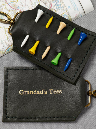 Handmade black leather golf tee holder with brass clip, featuring personalised white text. Holds up to six wooden golf tees—perfect golf gift for him, dad, or grandpa