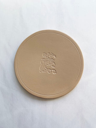 Hand painted leather coasters for private members club. A bespoke colour for this particular client.