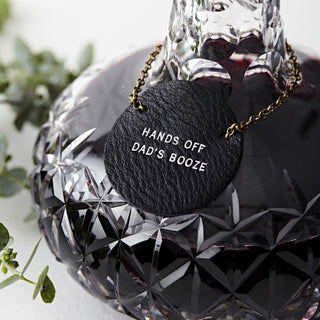 Premium tan leather bottle tag with gold embossed text reading 'Grandad’s Only', attached with an antique-style brass chain. A unique personalised gift for wine and whisky lovers