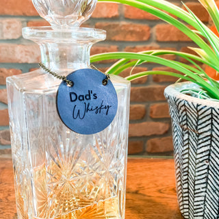 Laser engraved leather bottle tag.