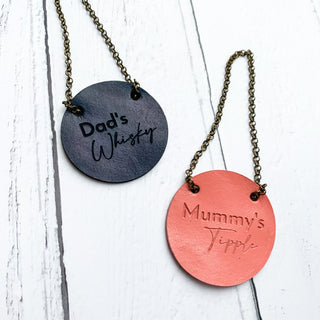 Laser engraved leather bottle tag.