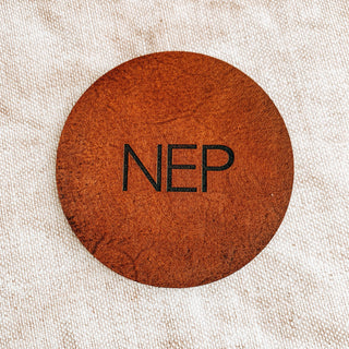 Block font laser engraved leather coasters, perfect anniversary gift.
