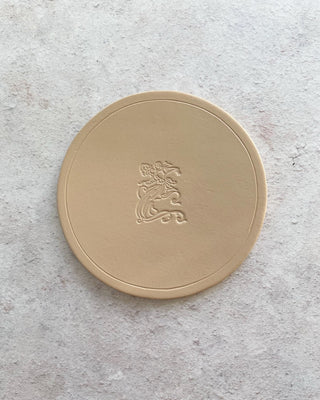 Your Logo De-bossed on a Coaster.