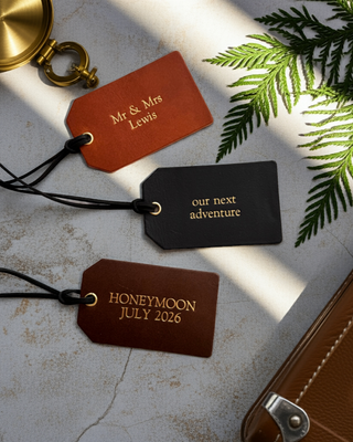 Luxury leather luggage tags in tan, black and brown.