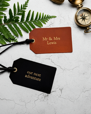 black and tan leather luggage labels.