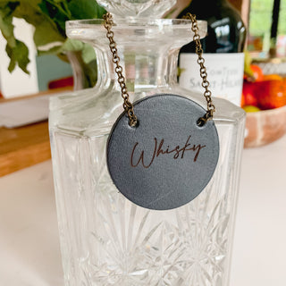 Navy leather bottle tag with script font